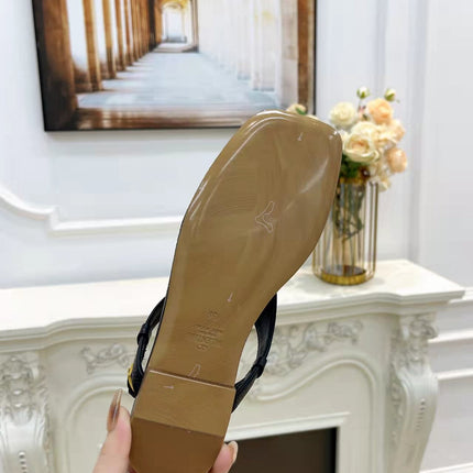 THONG SANDALS IN BLACK CALFSKIN WITH GOLD LOGO