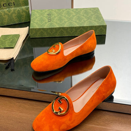 BLONDIE LOGO-PLAQUE LOAFERS IN TIGER ORANGE SUEDE WITH GOLD HARDWARE