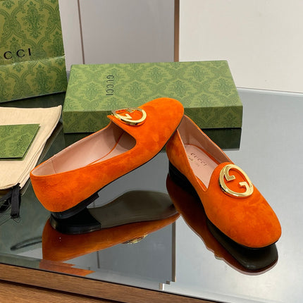 BLONDIE LOGO-PLAQUE LOAFERS IN TIGER ORANGE SUEDE WITH GOLD HARDWARE
