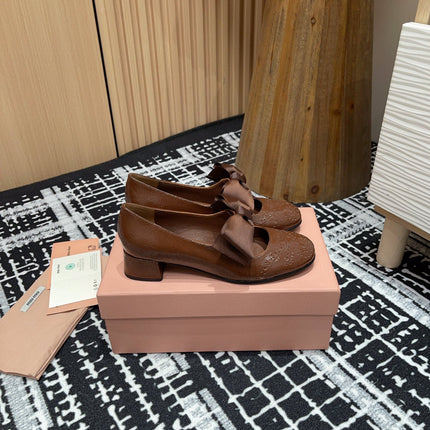 MARY JANE MID HEEL PUMPS IN RUSSET BROWN PATENT LAMBSKIN WITH BOW