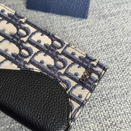 VERTICAL BIFOLD WALLET 19 IN BLACK GRAINED CALFSKIN MIX BLUE MONOGRAM OBLIQUE JACQUARD