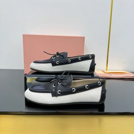 BOAT SHOES IN BLACK CALFSKIN AND WHITE CANVAS