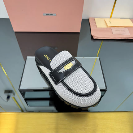 MULES SLIPPERS IN BLACK CALFSKIN AND WHITE DOTS CANVAS WITH GOLD COIN