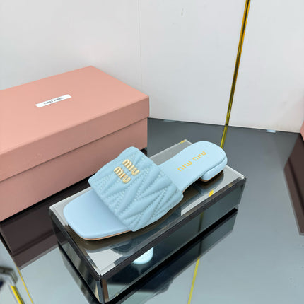 MATELASSÉ SLIDES IN BABY BLUE CALFSKIN