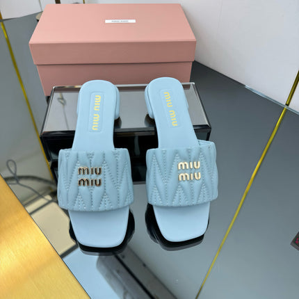 MATELASSÉ SLIDES IN BABY BLUE CALFSKIN
