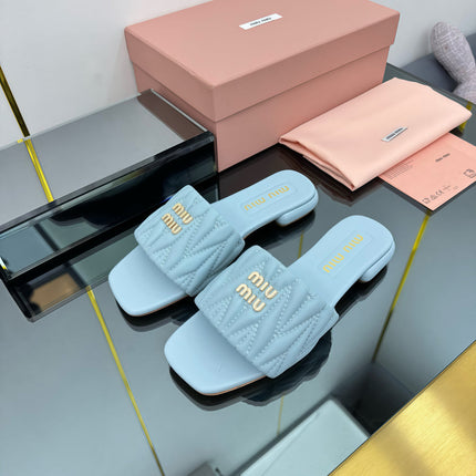 MATELASSÉ SLIDES IN BABY BLUE CALFSKIN