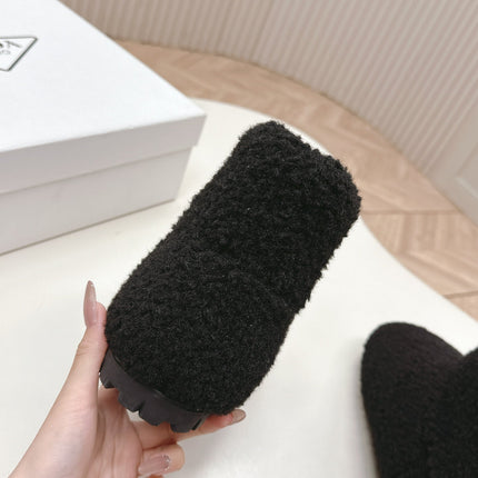 SNOW ANKLE BOOTS IN BLACK SHEARLING