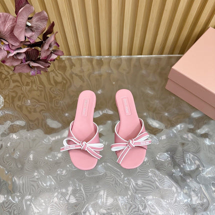 SLIDES SANDALS IN PINK CALFSKIN WITH BOW IN TRAP