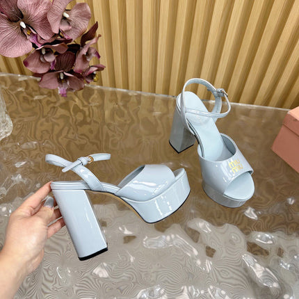 PLATFORM HEELS IN BABY BLUE PATENT CALFSKIN GOLD LOGO IN STRAP