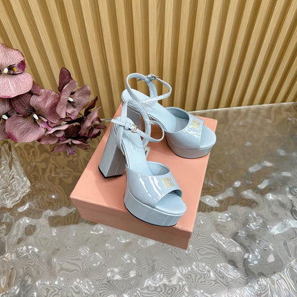 PLATFORM HEELS IN BABY BLUE PATENT CALFSKIN GOLD LOGO IN STRAP