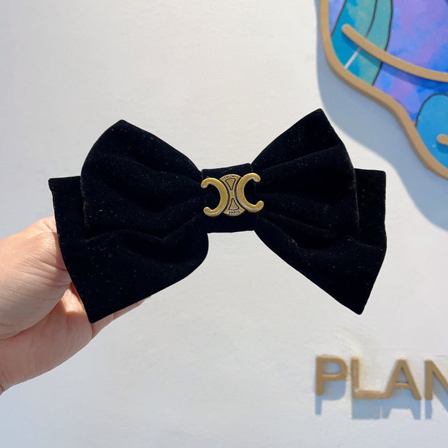 BLACK VELVET WITH GOLD LOGO HAIRPIN 387059