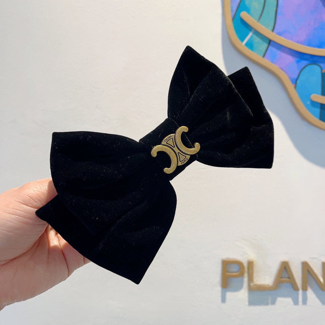 BLACK VELVET WITH GOLD LOGO HAIRPIN 387059