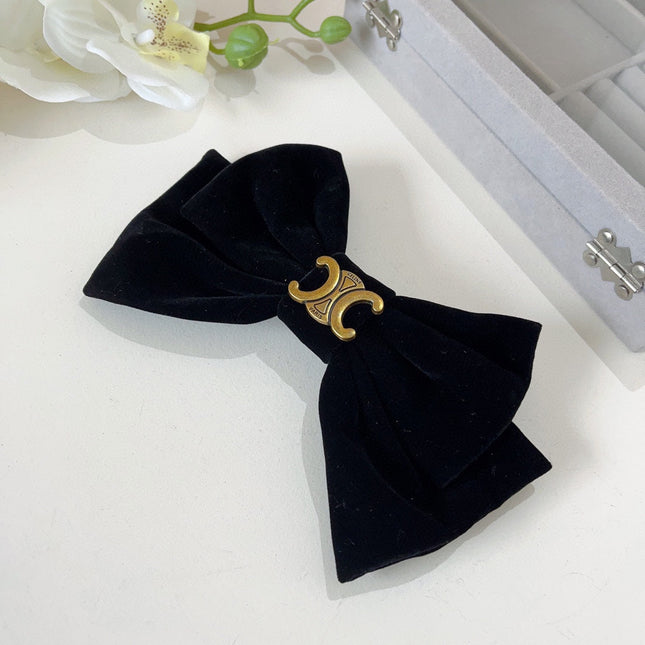 BLACK VELVET WITH GOLD LOGO HAIRPIN 387059