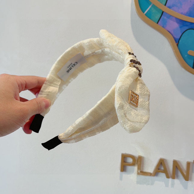 WHITE CREAM VOILE FABRIC WITH GOLD LOGO 391641