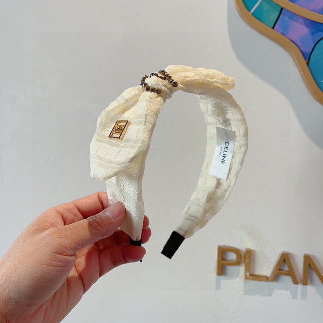 WHITE CREAM VOILE FABRIC WITH GOLD LOGO 391641