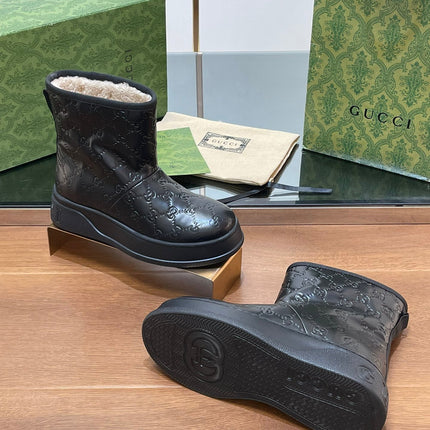 GG UGG BOOTS IN BLACK EMBOSSED DEERSKIN AND BEIGE WOOL LINING