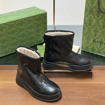 GG UGG BOOTS IN BLACK EMBOSSED SUEDE AND BEIGE WOOL LINING