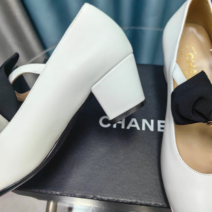 HIGH MARY JANE SHOES WHITE SHEEPSKIN WITH BLACK BOW