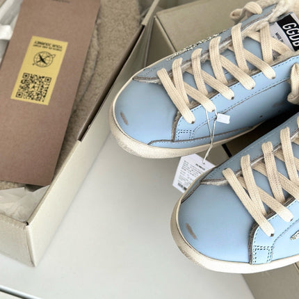 SUPER-STAR SABOTS IN BLUE CALFSKIN WITH GLITTER WHITE STAR