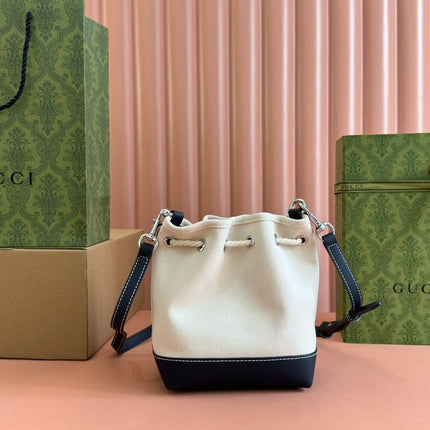 SMALL DRAWSTRING SHOULDER BAG 21 IN WHITE CANVAS DARK BLUE CALFSKIN