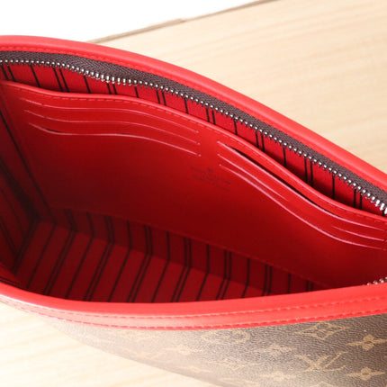 LV 25S POCHETTE VOYAGE 26 IN SARI RED MONOGRAM MACASSAR COATED CANVAS