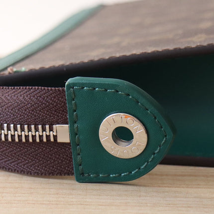 LV 25S POCHETTE VOYAGE 26 IN BORNEO GREEN MONOGRAM MACASSAR COATED CANVAS