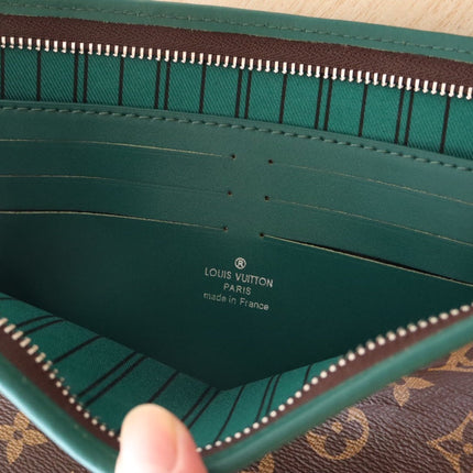 LV 25S POCHETTE VOYAGE 26 IN BORNEO GREEN MONOGRAM MACASSAR COATED CANVAS
