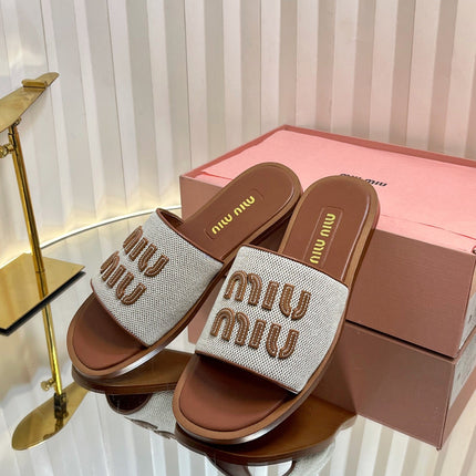 SLIDES SANDALS IN BROWN STRAW WOVEN