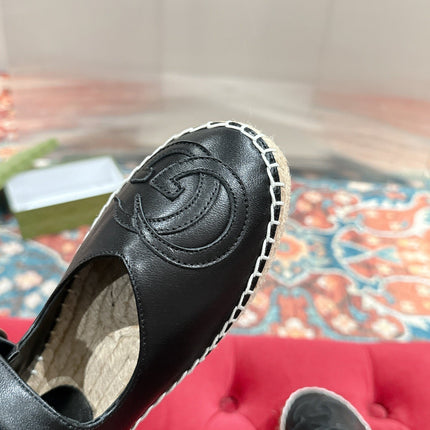 GG CROSS STRAP FLAT SHOES IN BLACK CALFSKIN WITH STRAW SOLE