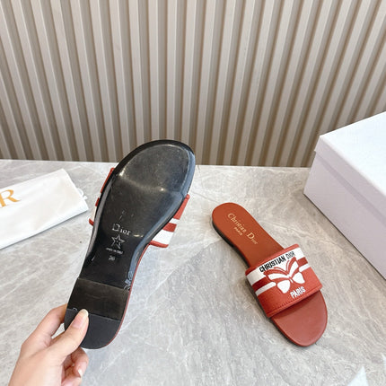 DIOR FLAT SLIDES 25S IN DARK ORANGE CALFSKIN AND FABRIC BRAND NAME EMBROIDERY