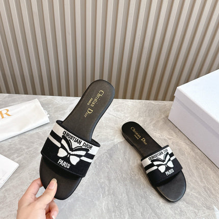 DIOR FLAT SLIDES 25S IN BLACK CALFSKIN AND FABRIC BRAND NAME EMBROIDERY