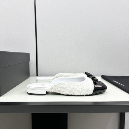 BOW MULE IN WHITE FUR AND BLACK CALFSKIN