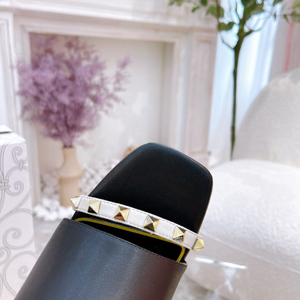 ROCKSTUD TOWER-HEEL MULES IN BLACK CALFSKIN 7 CM