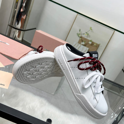 SNEAKER MULES IN BLACK AND WHITE CALFSKIN WHITE RED LACES