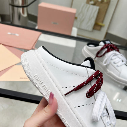 SNEAKER MULES IN BLACK AND WHITE CALFSKIN WHITE RED LACES