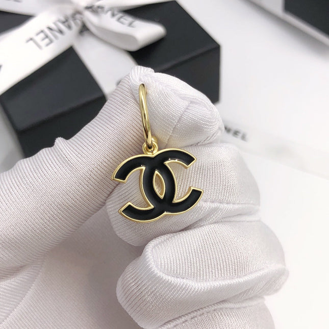CC GOLD BLACK ENAMEL DROP EARRINGS