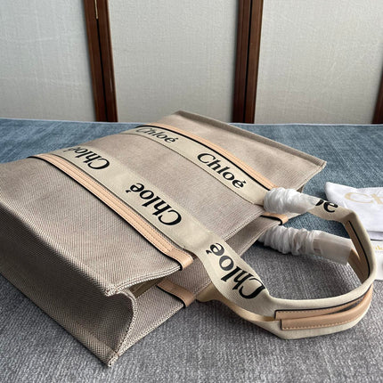 LAGRE WOODY TOTE BAG 45 IN BEIGE LINEN CANVAS BLACK WEBBING LOGO EMBROIDER NUDE CALFSKIN