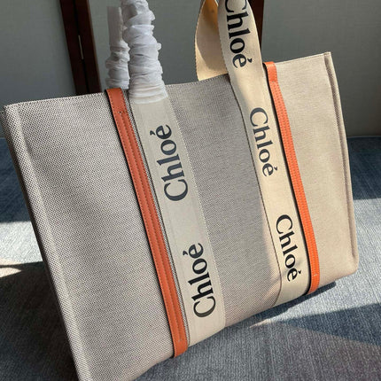 LAGRE WOODY TOTE BAG 45 IN BEIGE LINEN CANVAS BLACK WEBBING LOGO EMBROIDER ORANGE CALFSKIN
