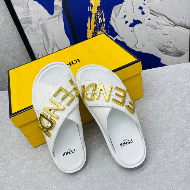 FENDI GRAPHY LOGO LETTERING SLIDES IN WHITE LAMBSKIN WITH GOLD HARDWARE