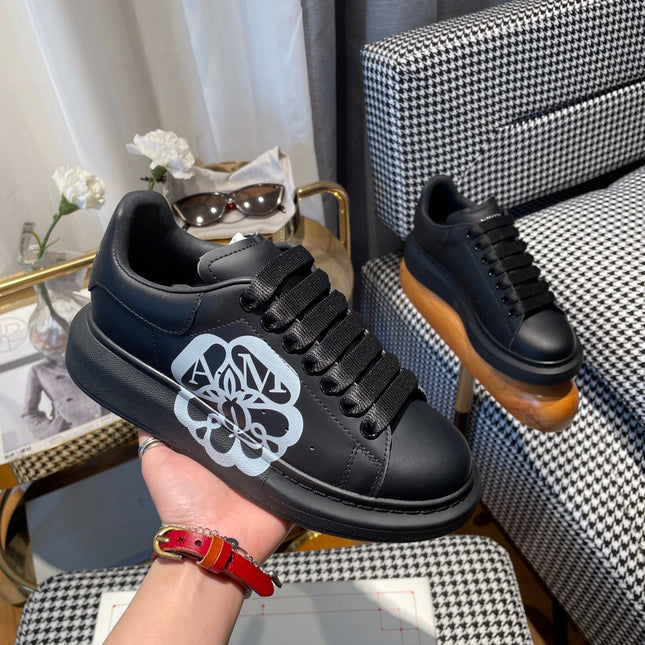 OVERSIZED SNEAKERS IN BLACK CALFSKIN WITH WHITE MONOGRAM LOGO
