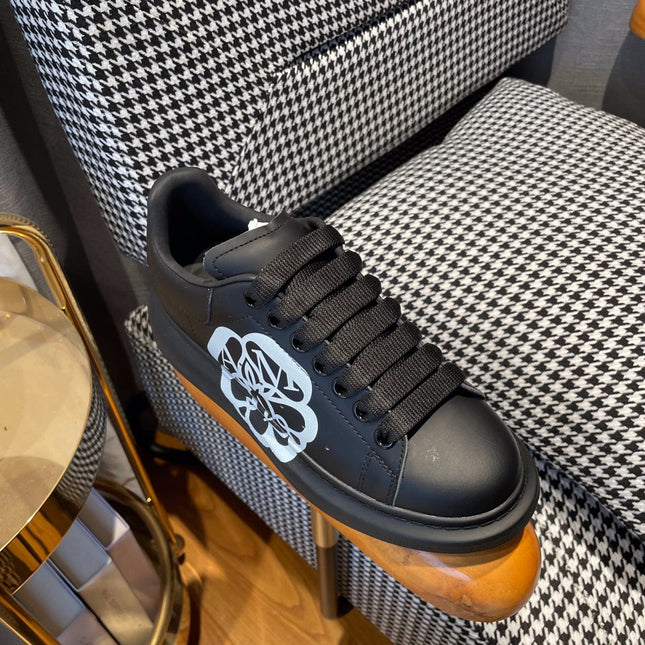 OVERSIZED SNEAKERS IN BLACK CALFSKIN WITH WHITE MONOGRAM LOGO