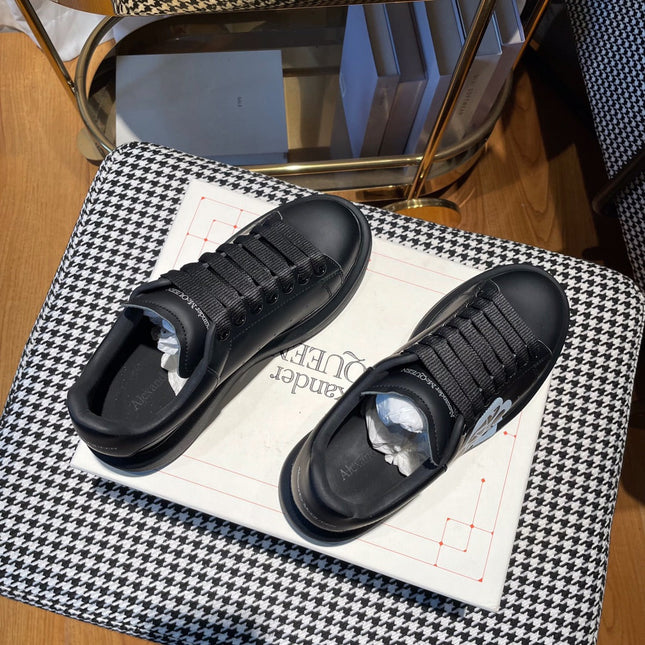 OVERSIZED SNEAKERS IN BLACK CALFSKIN WITH WHITE MONOGRAM LOGO