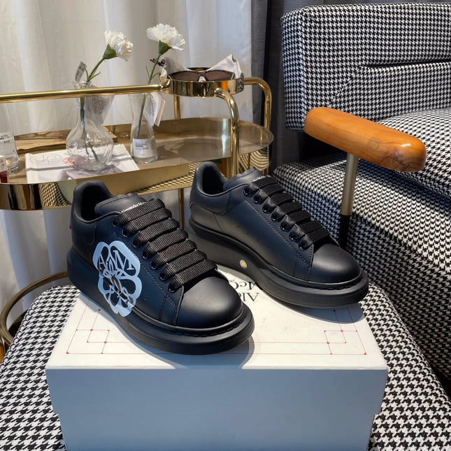 OVERSIZED SNEAKERS IN BLACK CALFSKIN WITH WHITE MONOGRAM LOGO