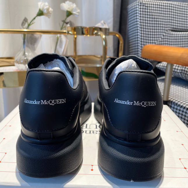 OVERSIZED SNEAKERS IN BLACK CALFSKIN WITH WHITE MONOGRAM LOGO