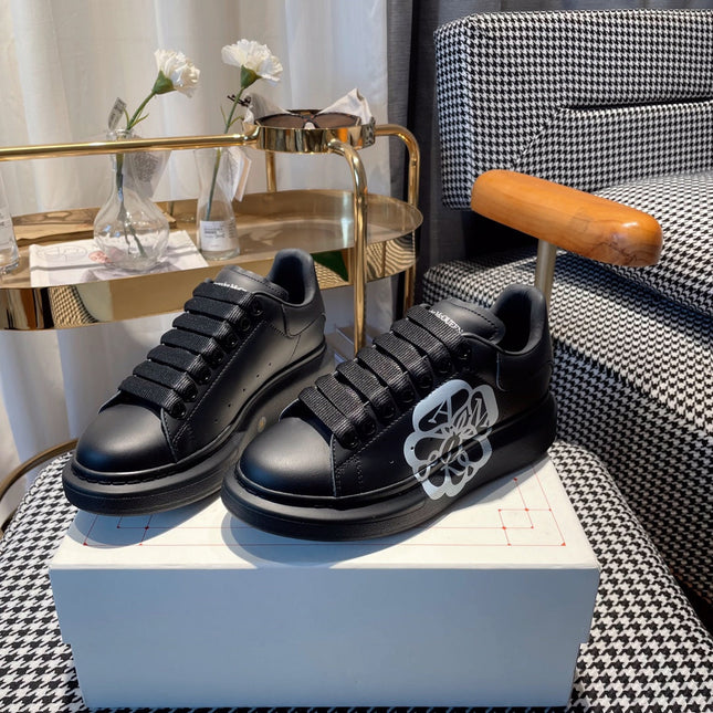 OVERSIZED SNEAKERS IN BLACK CALFSKIN WITH WHITE MONOGRAM LOGO