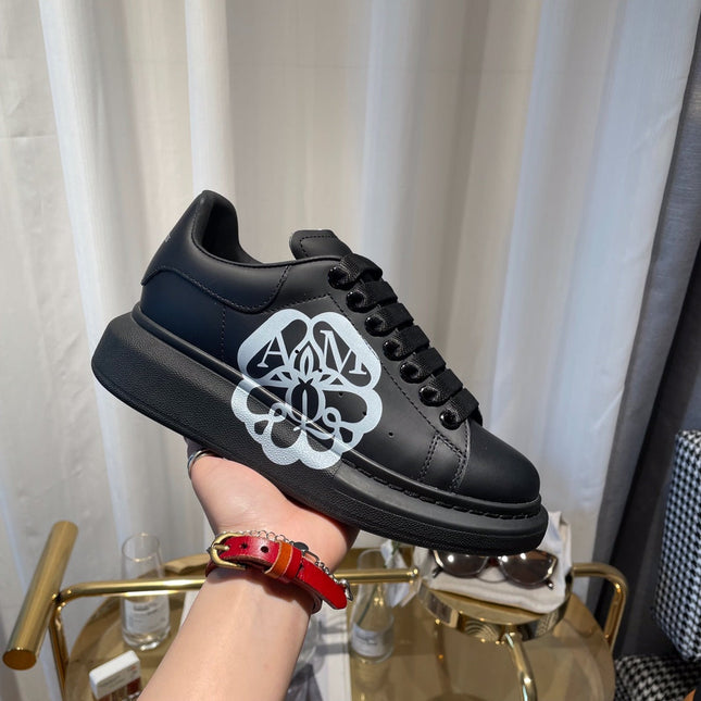 OVERSIZED SNEAKERS IN BLACK CALFSKIN WITH WHITE MONOGRAM LOGO