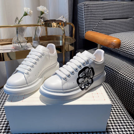 OVERSIZED SNEAKERS IN WHITE CALFSKIN WITH BLACK MONOGRAM LOGO