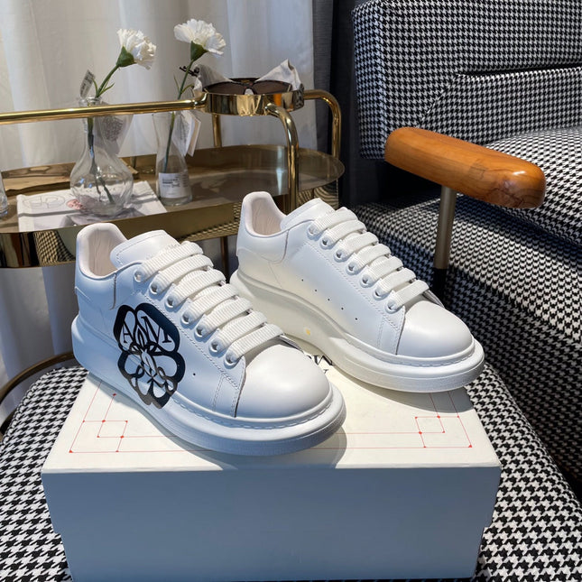 OVERSIZED SNEAKERS IN WHITE CALFSKIN WITH BLACK MONOGRAM LOGO
