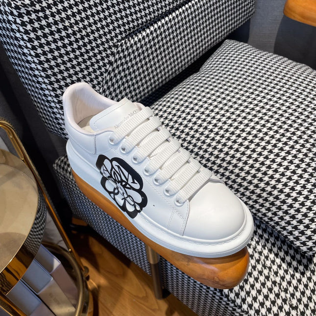 OVERSIZED SNEAKERS IN WHITE CALFSKIN WITH BLACK MONOGRAM LOGO