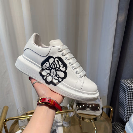 OVERSIZED SNEAKERS IN WHITE CALFSKIN WITH BLACK MONOGRAM LOGO